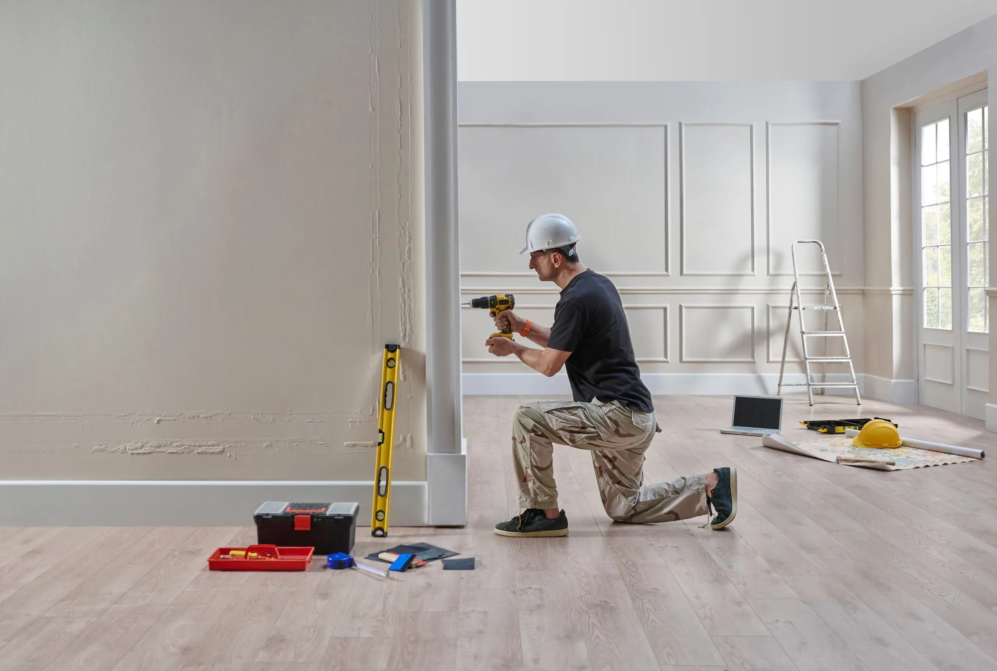 Calgary home renovation in progress with exposed framing and walls showing areas where unexpected repair costs may arise.